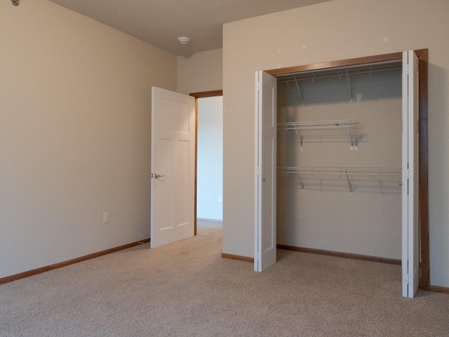 1370 SW Magazine Rd Unit 206, Ankeny, IA 50023 - unfurnished bedroom with carpet floors, a closet, and baseboards