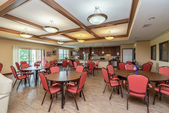 1370 SW Magazine Rd Unit 206, Ankeny, IA 50023 - dining area featuring light wood-style flooring and coffered ceiling