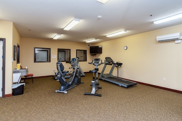 1370 SW Magazine Rd Unit 206, Ankeny, IA 50023 - gym featuring an AC wall unit, baseboards, and carpet
