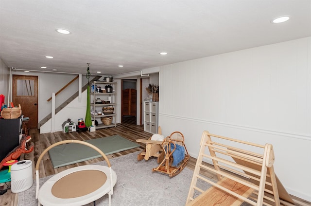 game room with recessed lighting and wood finished floors