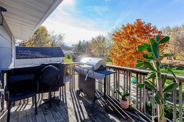 wooden deck featuring grilling area