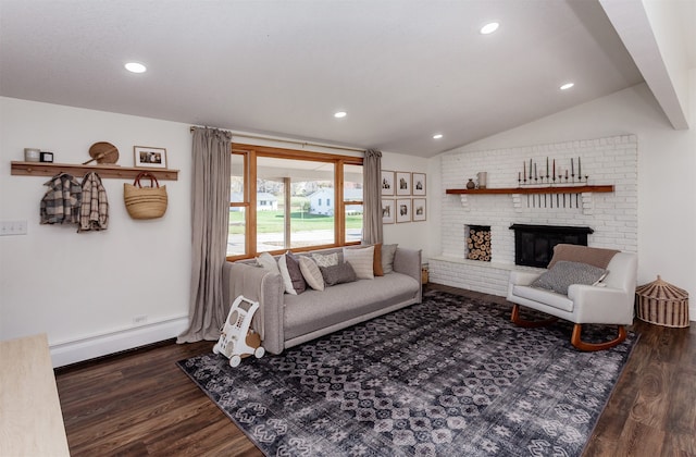 living room with a fireplace, dark hardwood / wood-style floors, baseboard heating, and vaulted ceiling