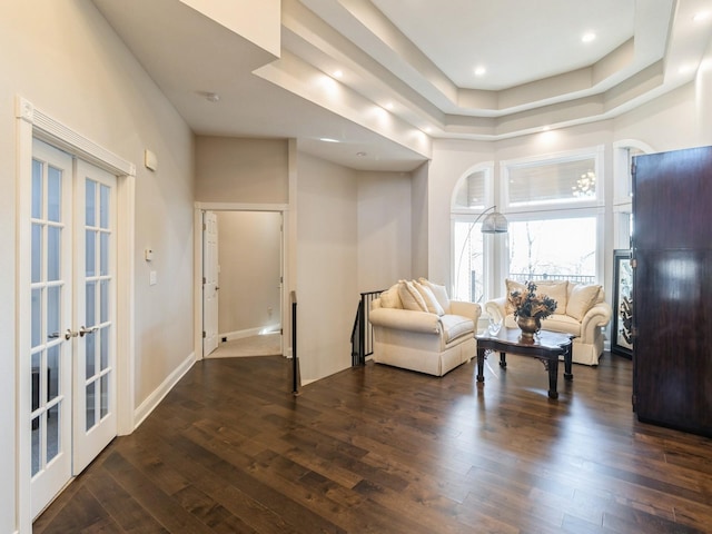 1885 Glen Oaks Dr, West Des Moines, IA 50266 - living room with dark wood-type flooring, french doors, a tray ceiling, and recessed lighting