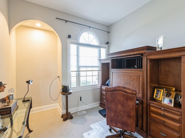 1885 Glen Oaks Dr, West Des Moines, IA 50266 - carpeted home office featuring arched walkways and baseboards