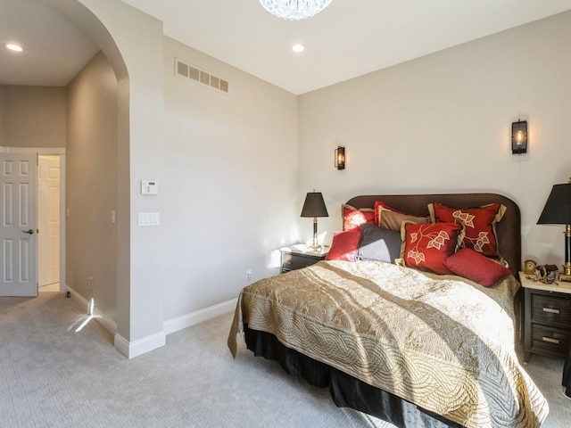 bedroom featuring light carpet