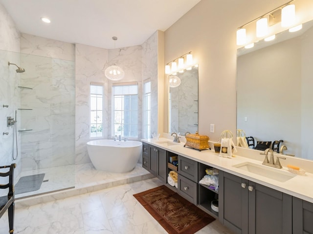 1885 Glen Oaks Dr, West Des Moines, IA 50266 - bathroom with marble tiled floors, double vanity, a marble finish shower, and a freestanding bath