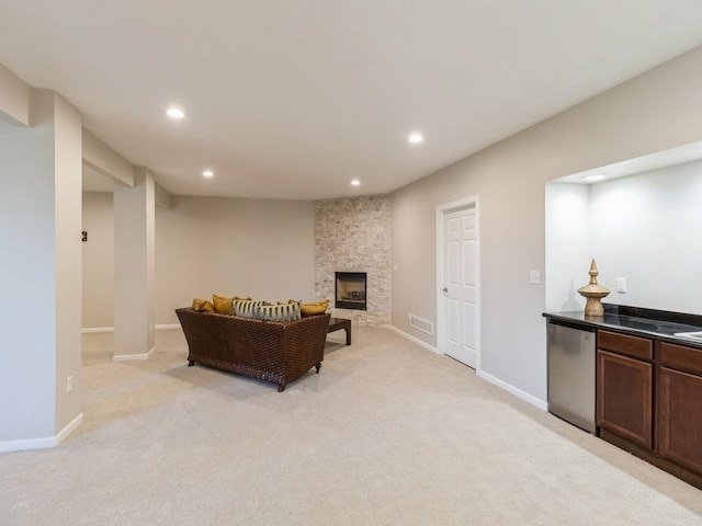 1885 Glen Oaks Dr, West Des Moines, IA 50266 - living area with recessed lighting, light carpet, a fireplace, and baseboards