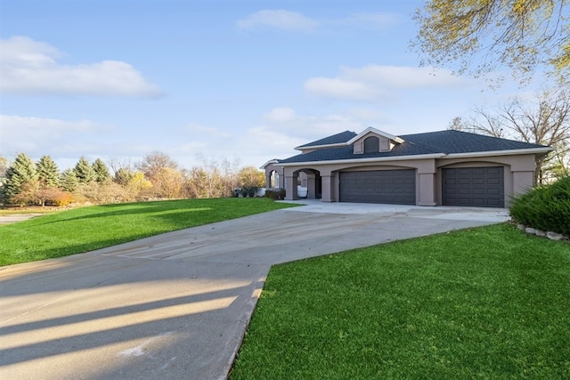 single story home featuring a garage and a front yard