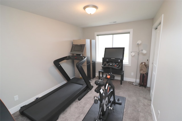 workout room with light carpet