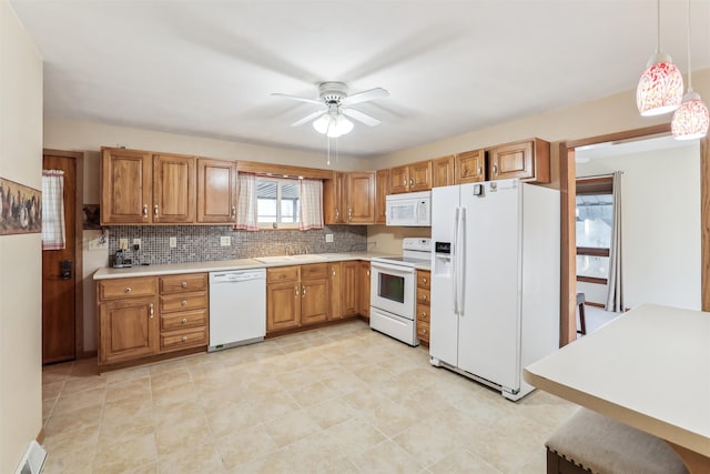 kitchen featuring decorative backsplash, white appliances, ceiling fan, light tile patterned floors, and hanging light fixtures