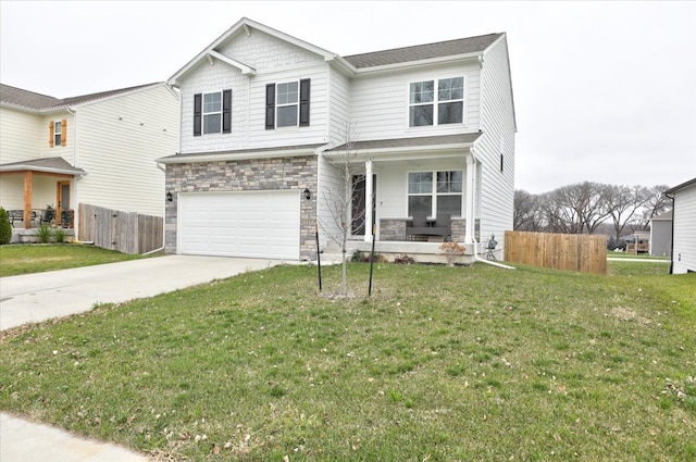 view of front of property with a front lawn and a garage