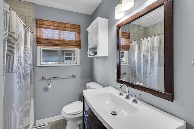 bathroom with a shower with curtain, vanity, and toilet