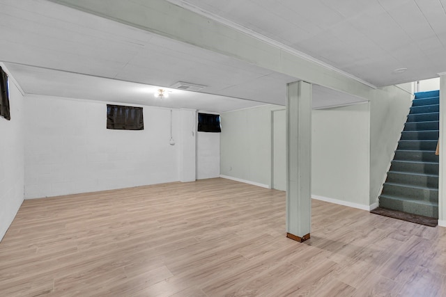 basement featuring light wood-type flooring