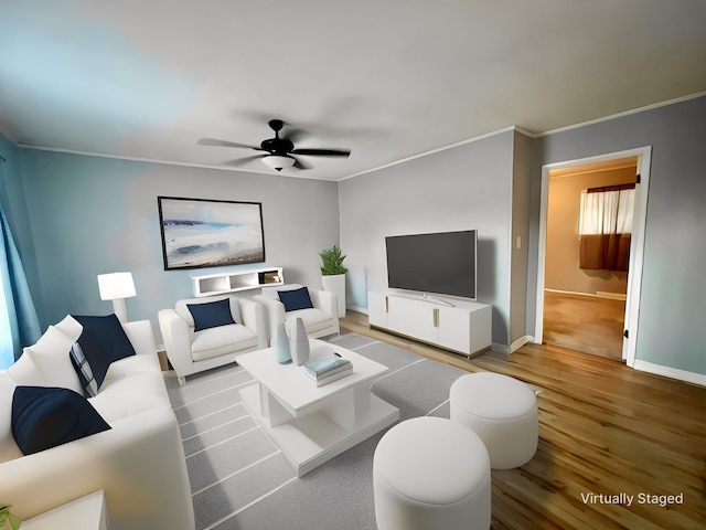 living room with ornamental molding, hardwood / wood-style floors, and ceiling fan