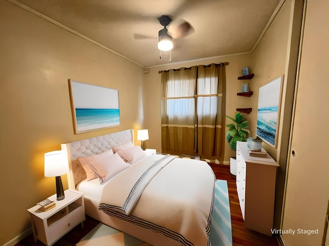 bedroom featuring crown molding, dark hardwood / wood-style floors, and ceiling fan