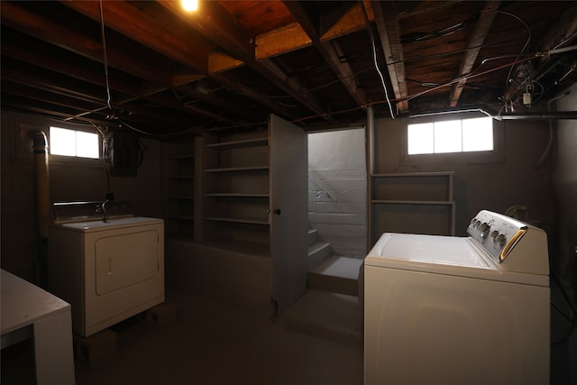 laundry room with a healthy amount of sunlight and washer and dryer