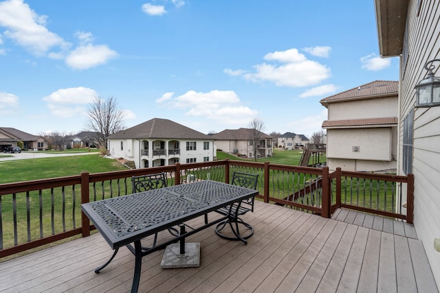 wooden terrace with a yard