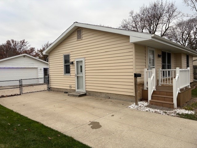 exterior space featuring an outbuilding and a garage