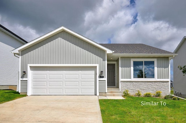 view of front of property with a garage and a front yard