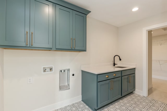 washroom with cabinets, hookup for a washing machine, electric dryer hookup, and sink