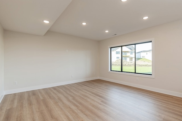 unfurnished room featuring light hardwood / wood-style floors