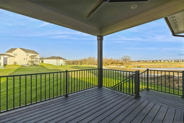 wooden terrace with a yard and ceiling fan