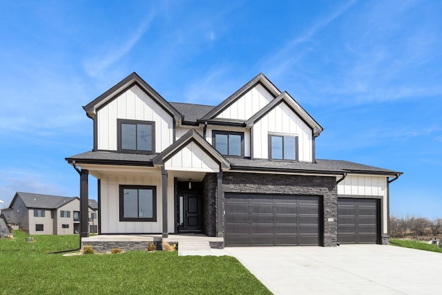 modern inspired farmhouse with a garage, a shingled roof, concrete driveway, board and batten siding, and a front yard