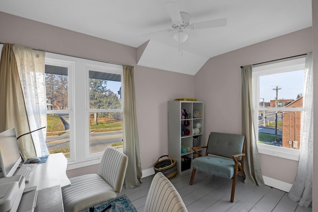 sitting room with ceiling fan, a healthy amount of sunlight, and lofted ceiling