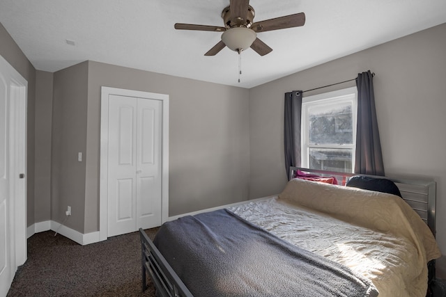 carpeted bedroom with ceiling fan and a closet