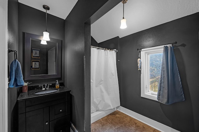 bathroom featuring a shower with shower curtain and vanity