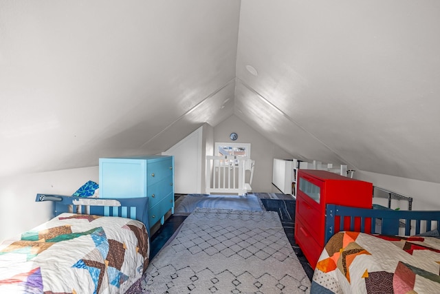 bedroom featuring lofted ceiling