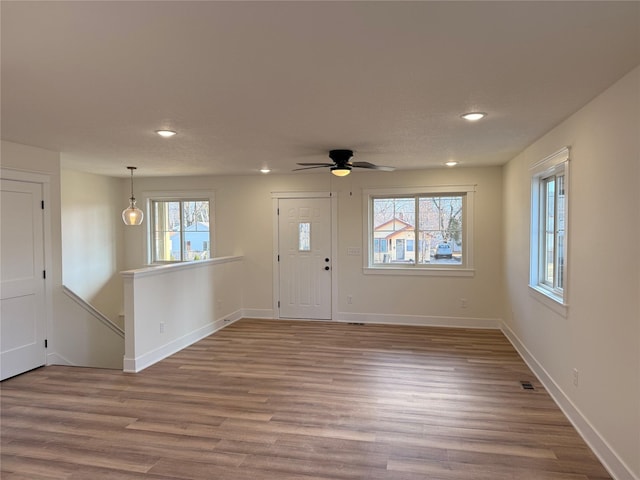 foyer entrance featuring ceiling fan and hardwood / wood-style floors