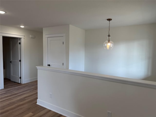 hall with dark hardwood / wood-style floors