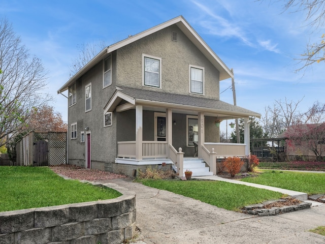 view of front of home with a porch and a front lawn