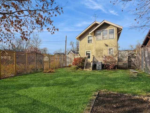 back of property with a lawn