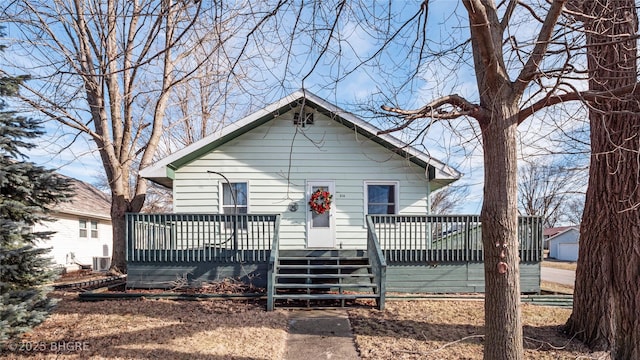 view of front of home with a deck and central AC unit