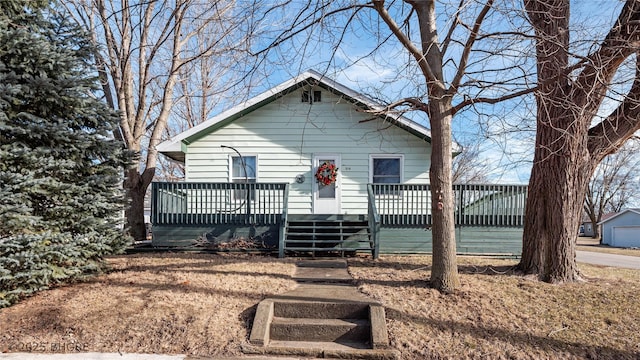 view of front of home featuring a wooden deck