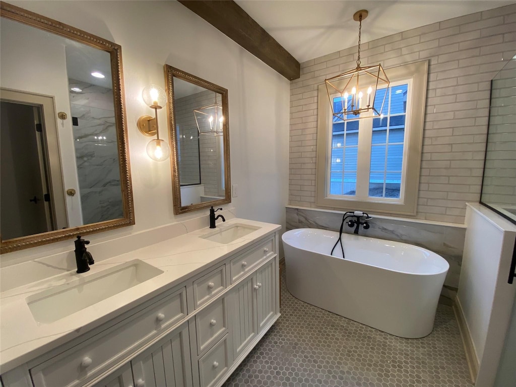 bathroom featuring a freestanding bath, double vanity, a sink, and beam ceiling