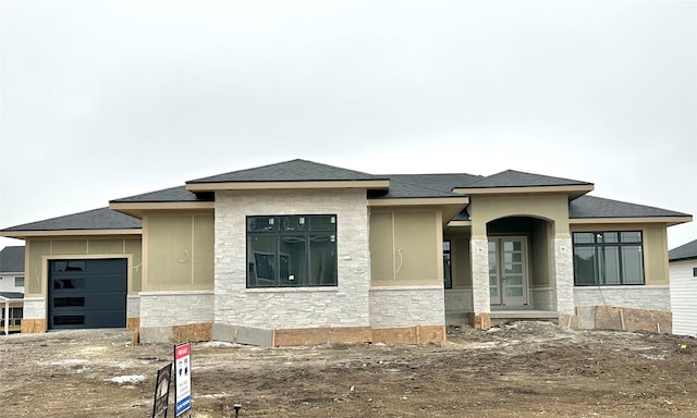 prairie-style house with a garage