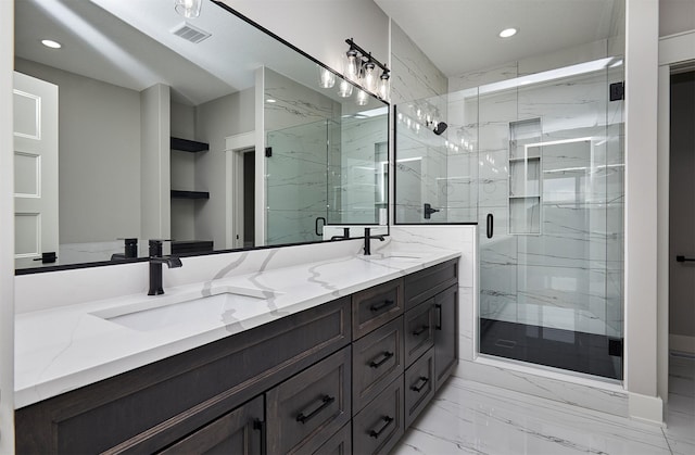 bathroom with visible vents, a sink, and recessed lighting