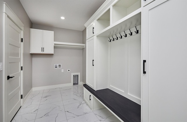 mudroom with recessed lighting, marble finish floor, and baseboards