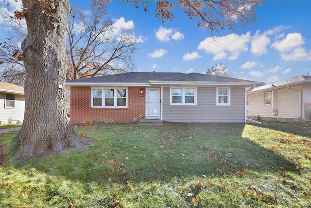 ranch-style home with a front lawn