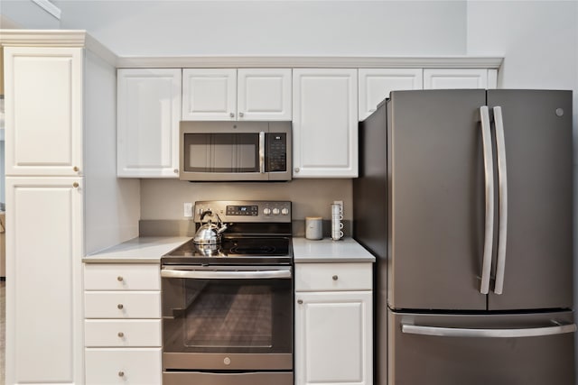 kitchen featuring white cabinetry and stainless steel appliances