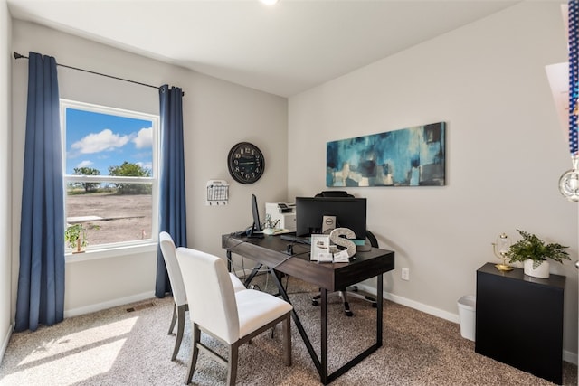 office area with carpet floors, visible vents, and baseboards