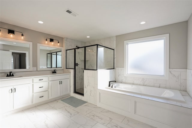 bathroom featuring vanity and plus walk in shower