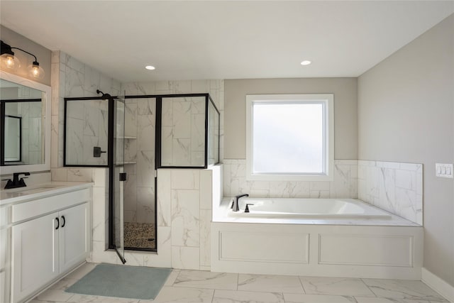 bathroom featuring vanity and separate shower and tub