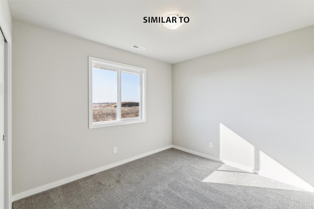 unfurnished room with carpet floors