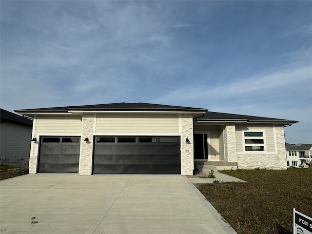 prairie-style home featuring a garage