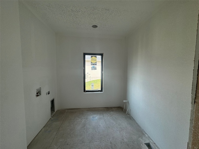 empty room with a textured ceiling