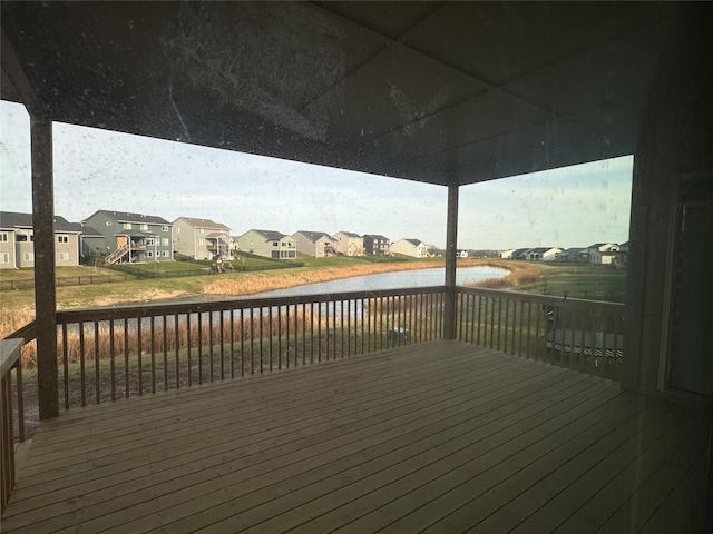 wooden deck featuring a water view